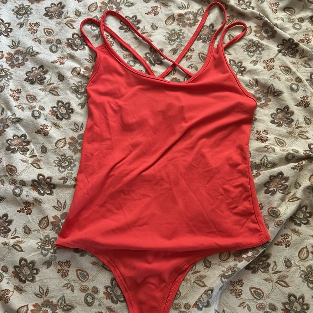 Orange/red body suit
